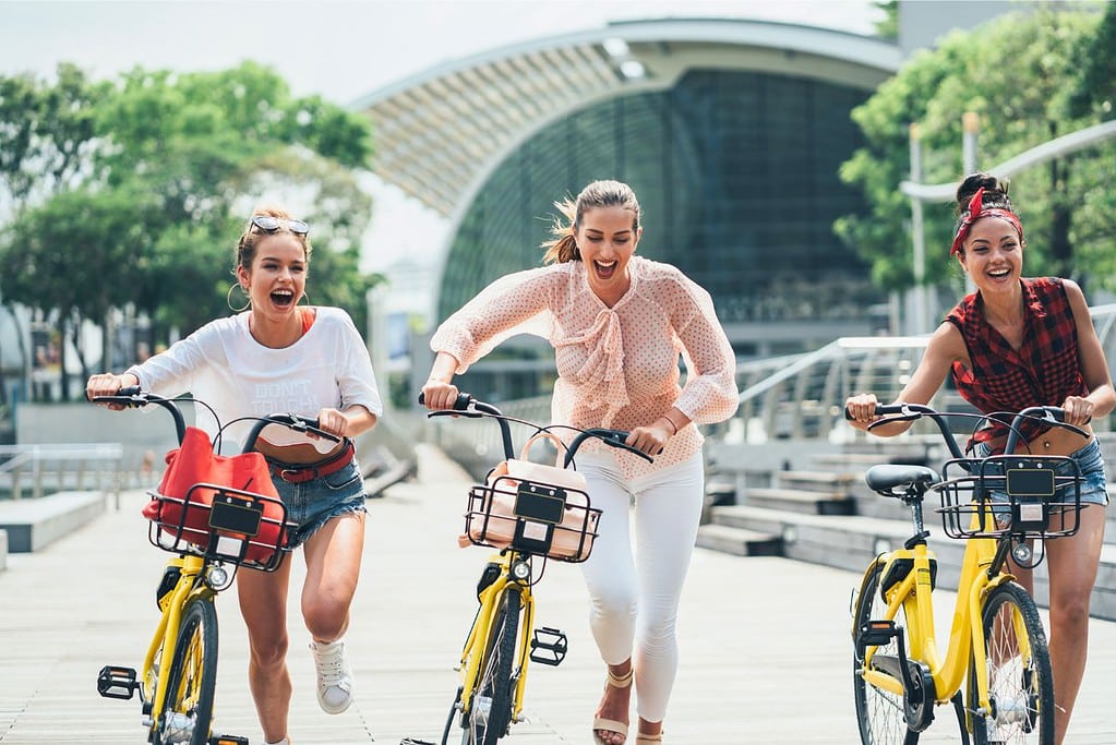 Girlfriends Running Bicycle