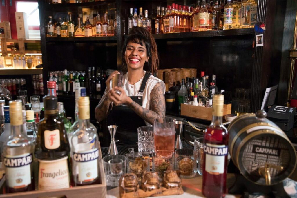 The Secret Mermaid Bartender Behind Bar Table Bottles