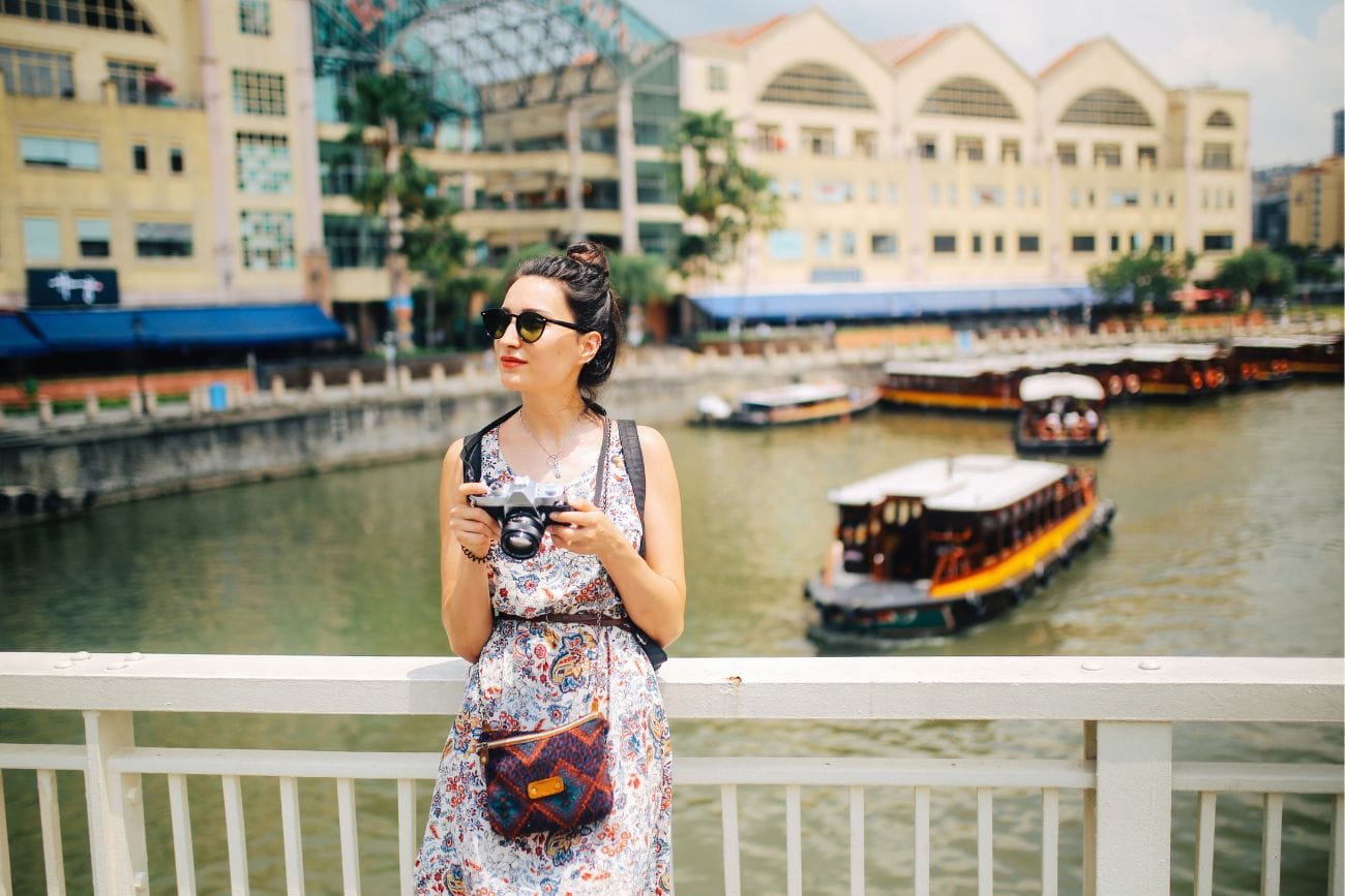 Worst Time To Visit Singapore: Tourist Advisories 2 Young Photographer Woman Taking Images Singapore River