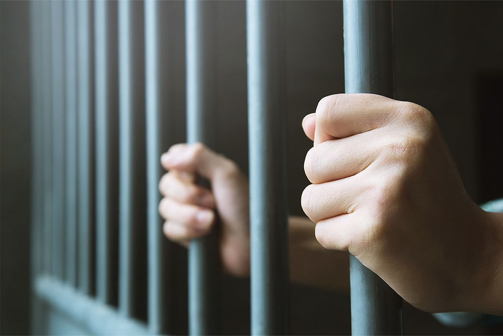 Man Prison Hands Behind Hold Steel Cage Jail Bars