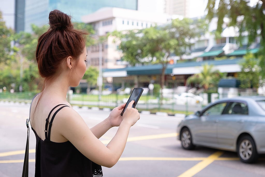 Young Woman Using Phone Grab Singapore