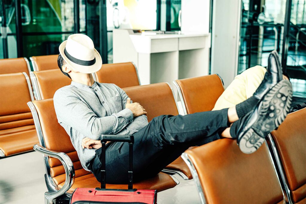 Young Traveler Man Sleeping Waiting Airline Flight Airport Terminal