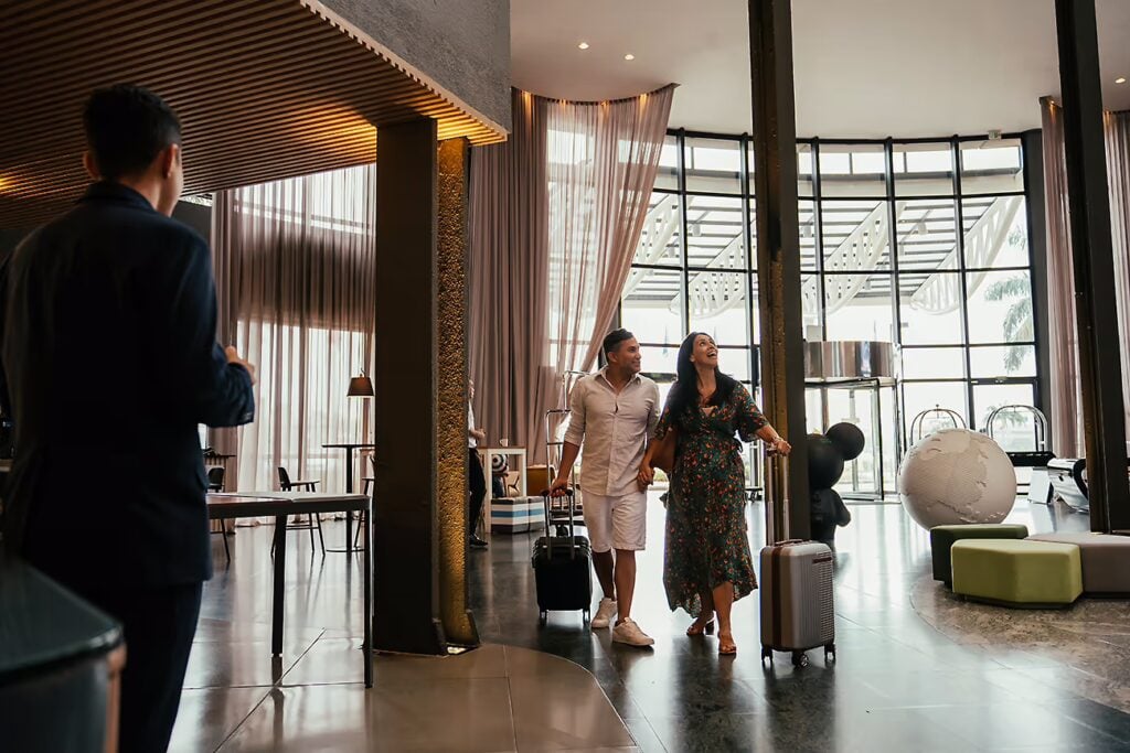 Effortless Jb Day Trip: A Singaporean'S Guide 7 Couple Checking In At Hotel