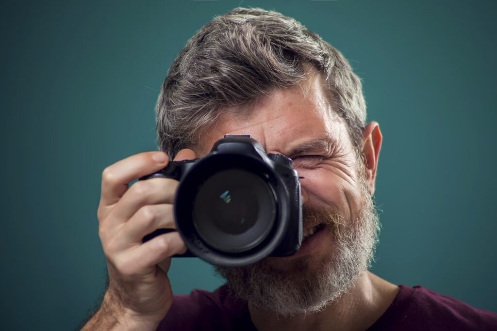 Navigating Singapore With Confidence: A Professional'S Guide To Local Laws &Amp; Etiquette 9 Bearded Photographer Holding Camera